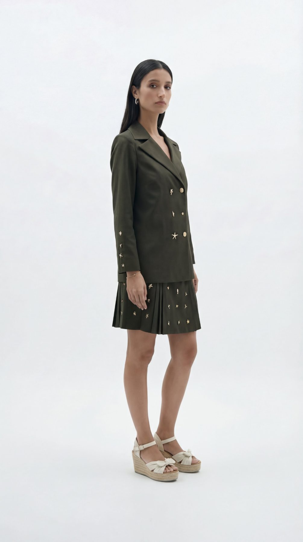 Olivia Full Sleeve Co-Ord Set, olive green gabardine cotton double-breasted blazer and skort co-ord set with gold-toned buttons and hand-embellished golden charms – styled on model